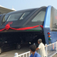Image for article titled Everything That Makes China's New Traffic-Straddling Bus So Fascinating